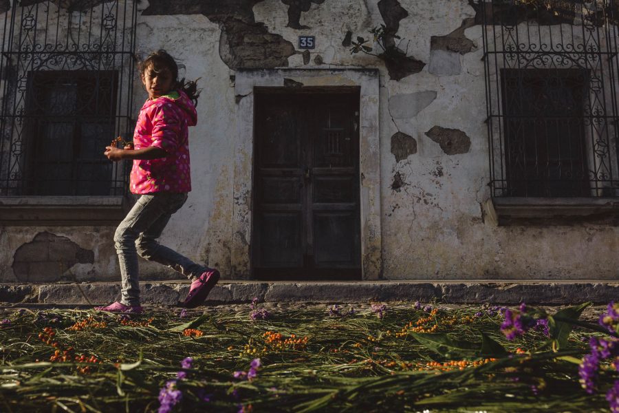 girl running by alfombra in Guatemala