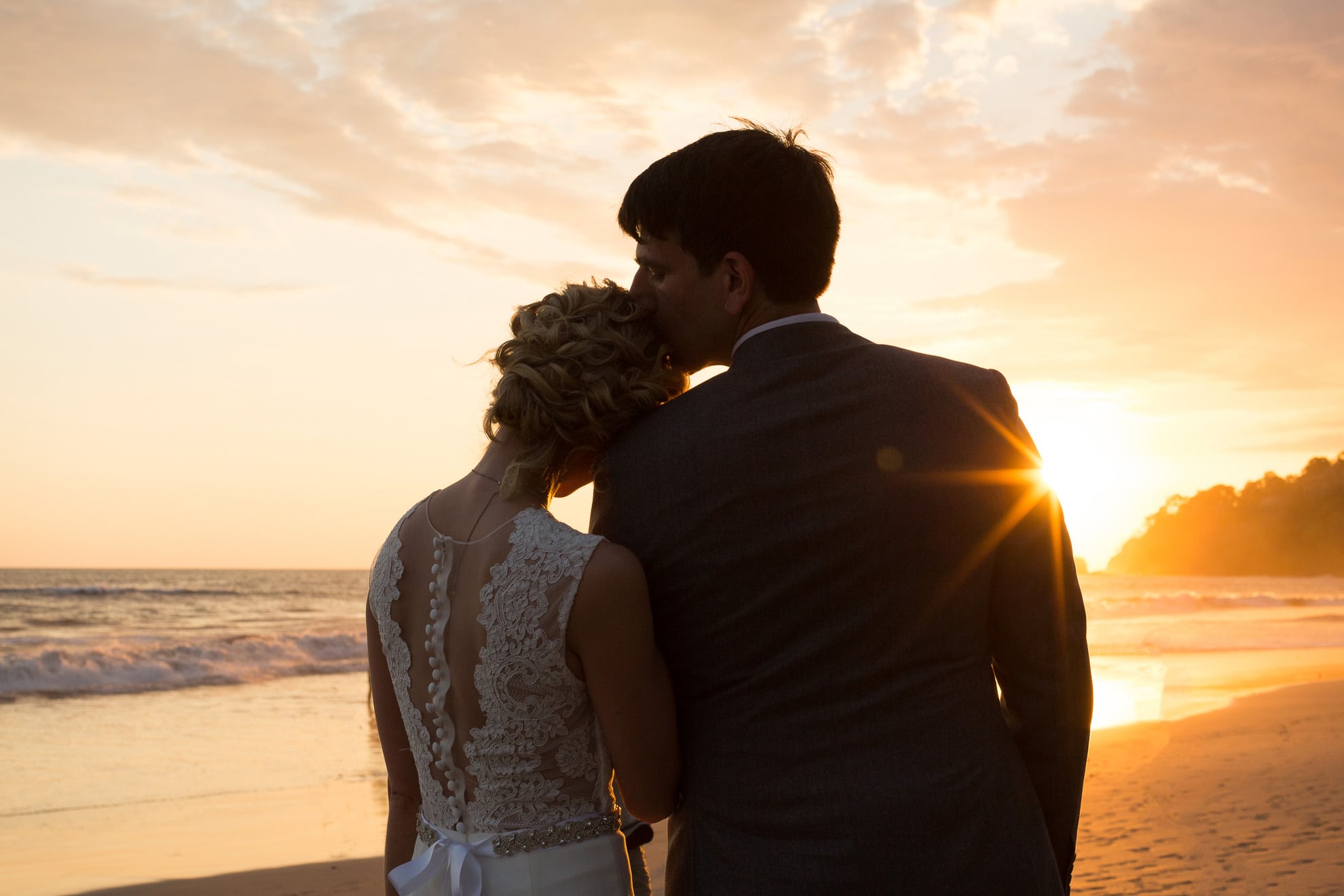 a kiss at sunset on manuel antonio beach