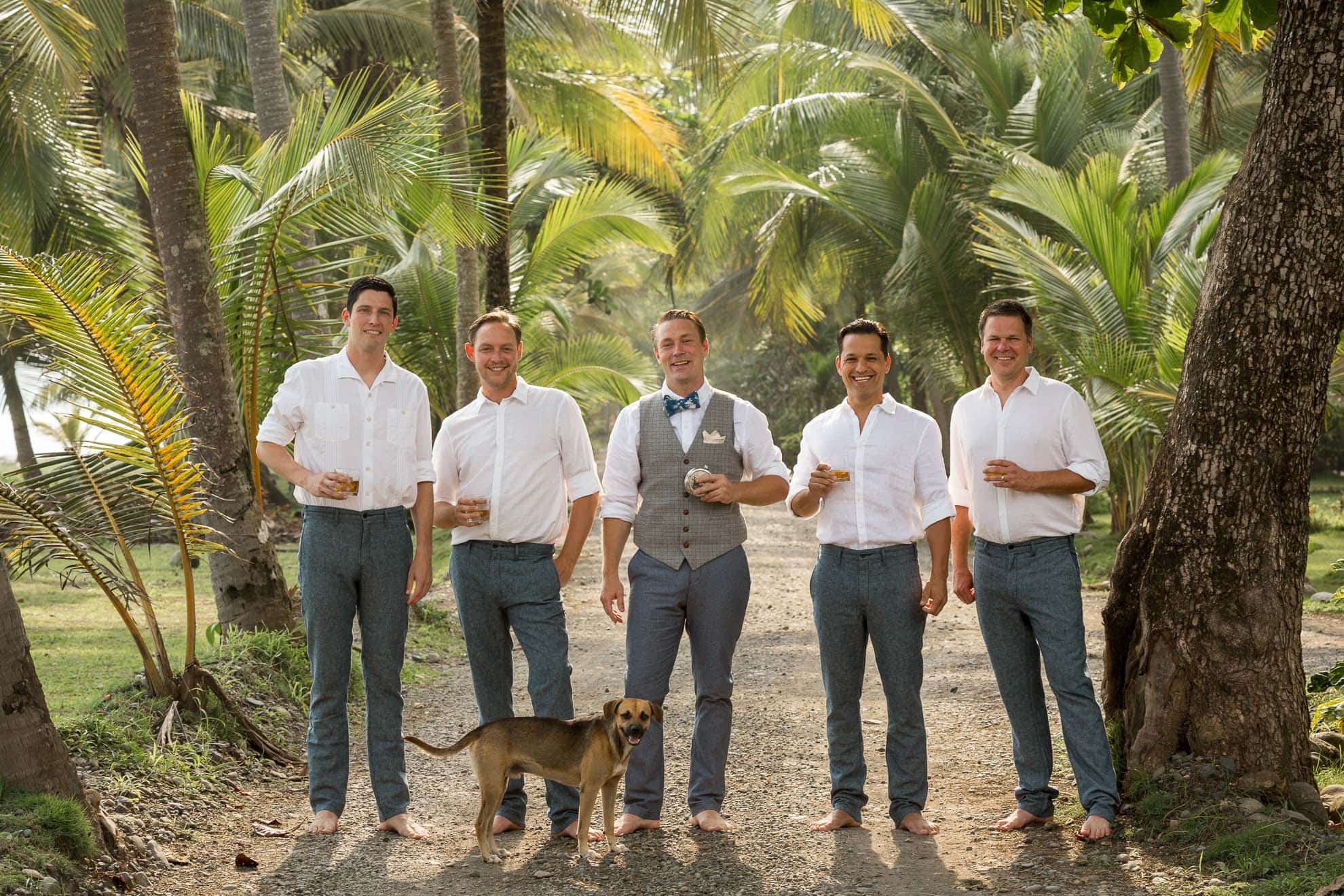groom with groomsmen and dog on bejuco beach