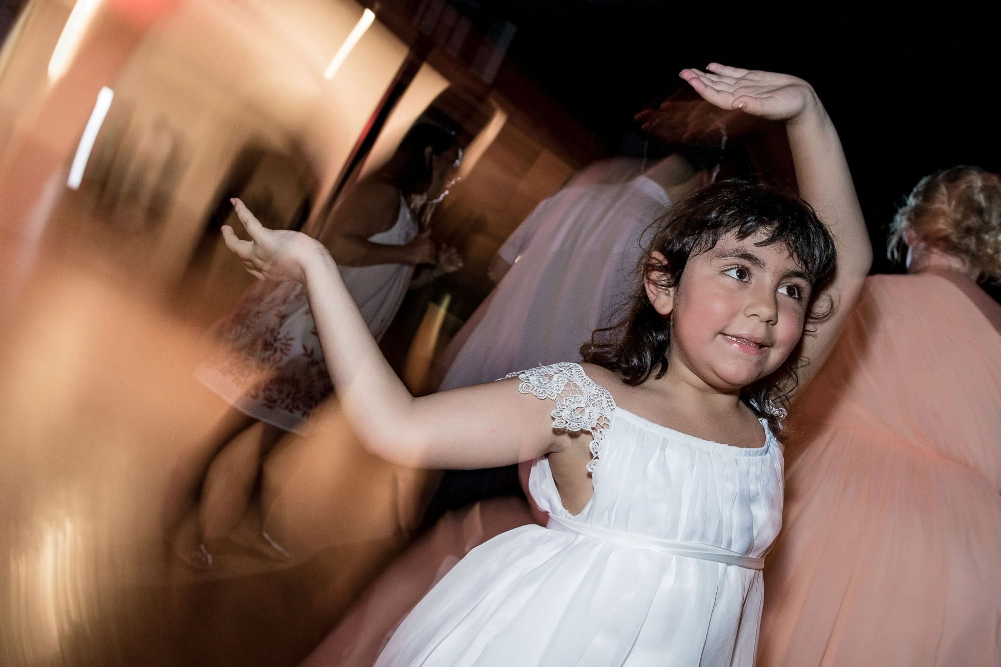 The flower girl showing off her dance moves