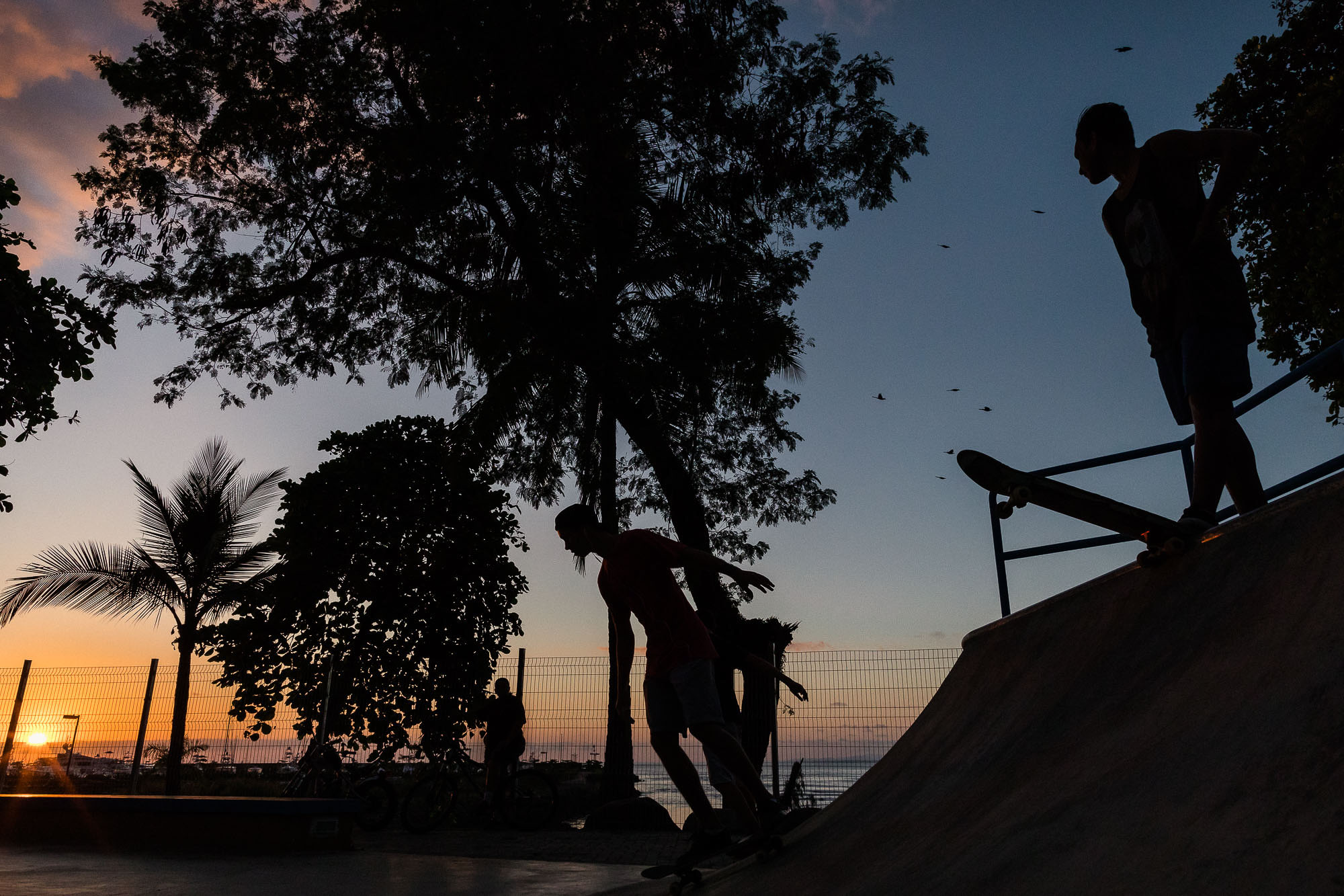 skaters in quepos costa rica at sunset