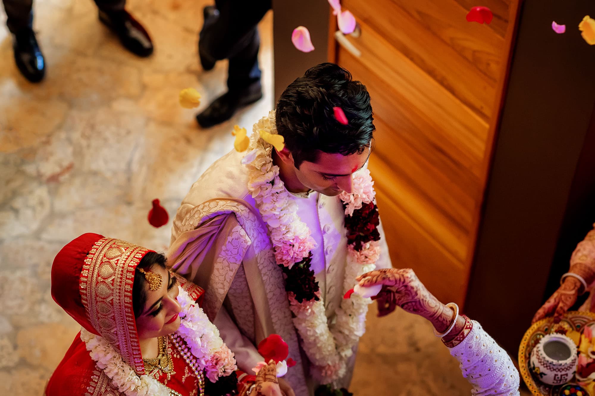 Throwing flower petals on the couple to bless them with prosperity and happiness