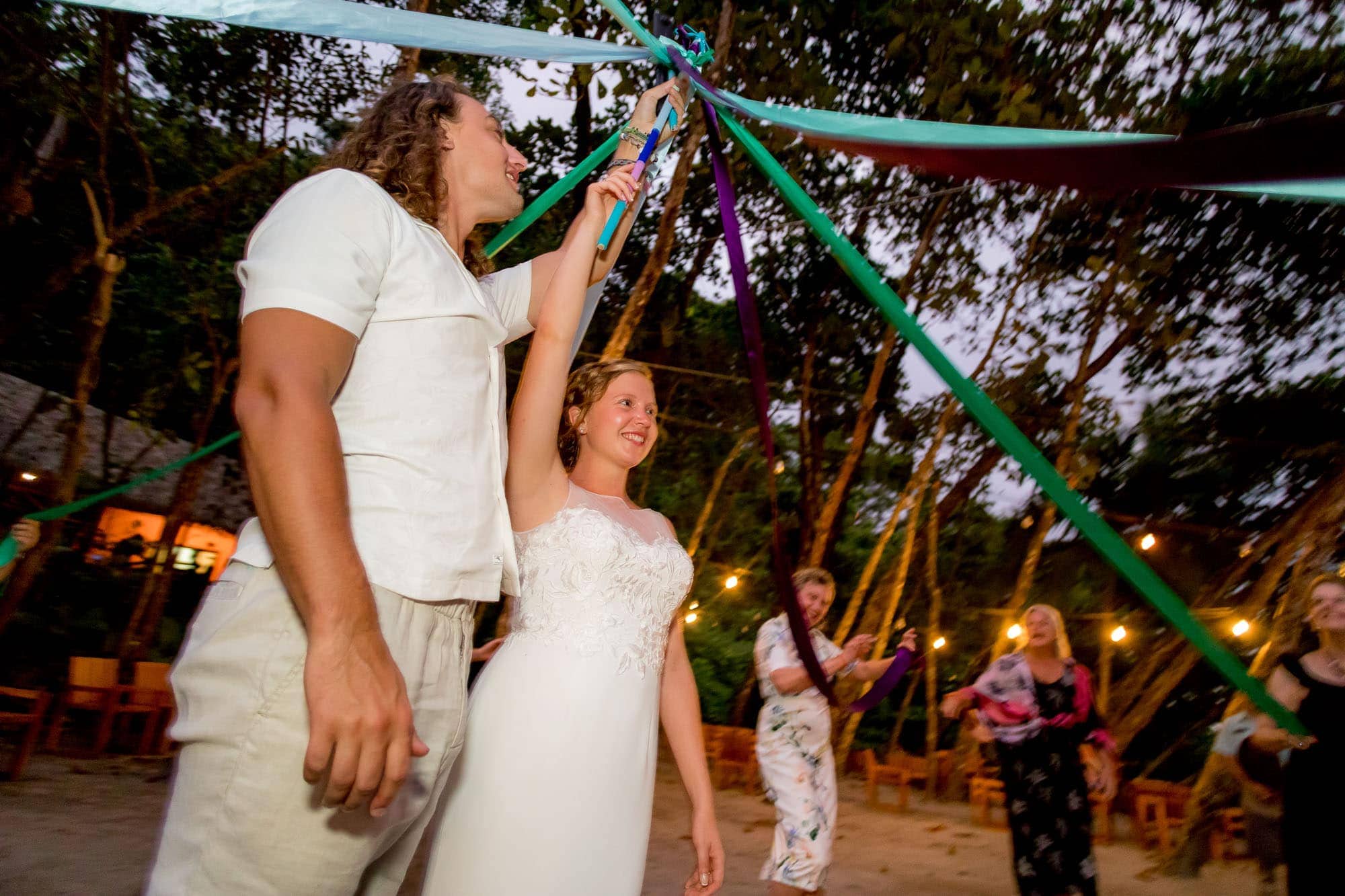 The bride and groom being the maypole for the maypole dance