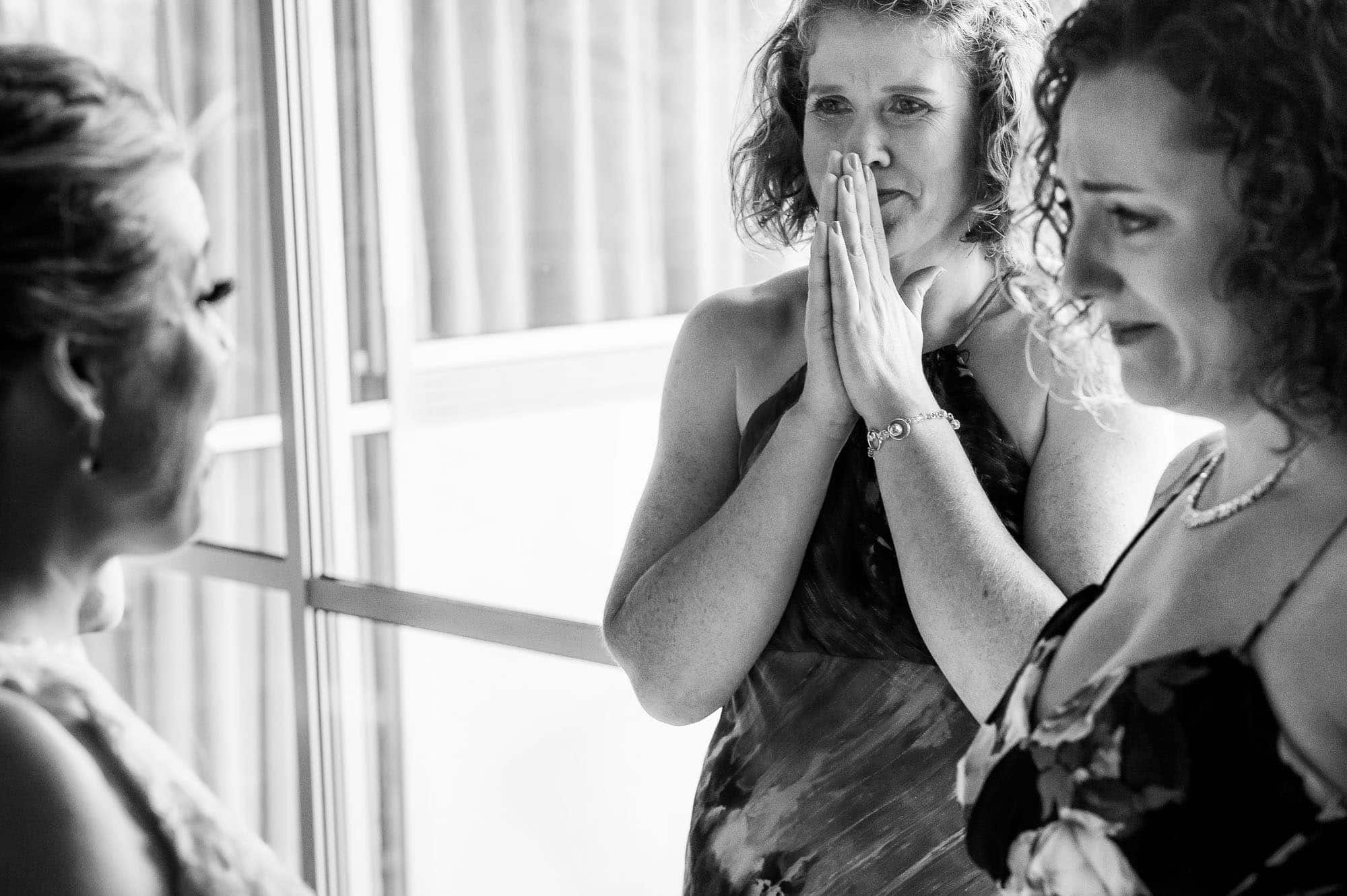 An emotional moment as the bride's friends view her with tears in their eyes