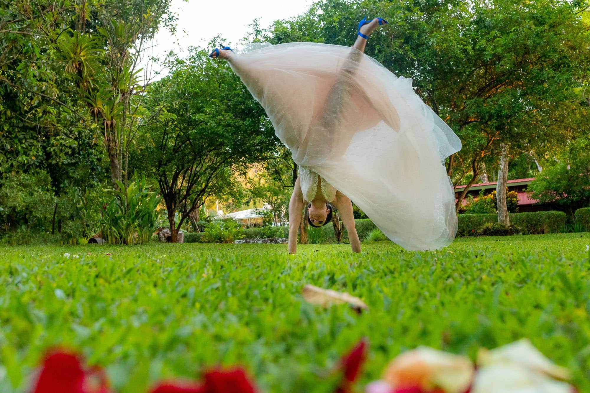 The bride performing a cartwheel in her dress!